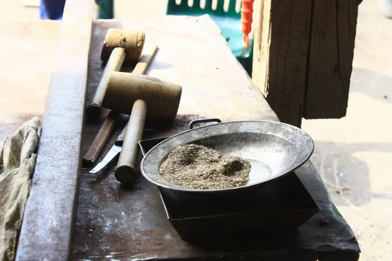 Coppersmith’s tools: wooden mallets and a metal tray