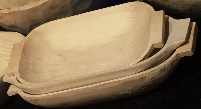 Carved wooden bowls stacked inside each other